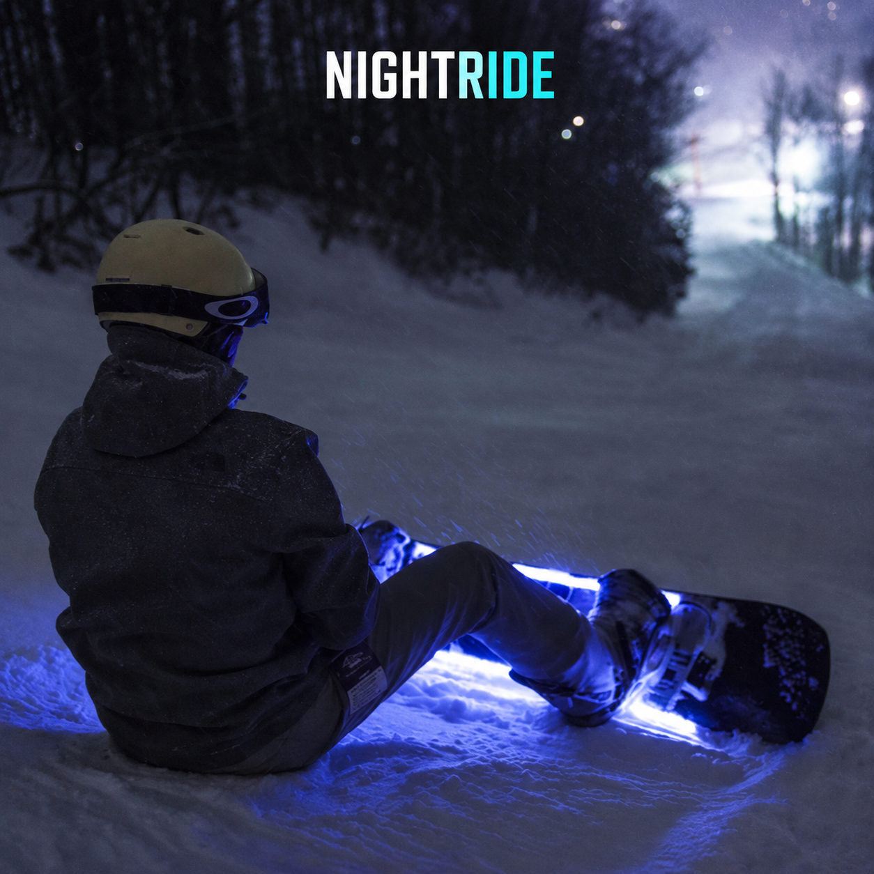 Seated rider with blue snowboard lights
