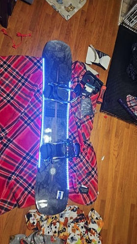 Snowboard with blue LED strips on a plaid blanket, supplied with Daniel F.’s review